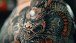 A detailed close-up of a black and grey dragon tattoo with intricate scales and ferocious expression