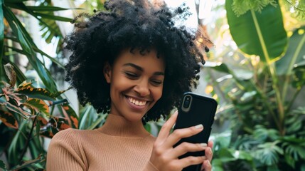 A cheerful woman uses her smartphone amidst lush greenery, a perfect blend of technology and nature