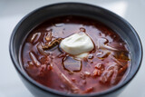 Fototapeta Desenie - Ukrainian borscht in a bowl on a light background, home cooking