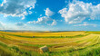 Breathtaking panorama of a wide-open golden field with hay bales under a clear blue sky in summer season