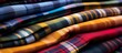 Vivid Tartan patterned plaid fabric in various tints and shades, featuring electric blue tones, displayed in a closeup shot, showcasing the intricate textile craftsmanship