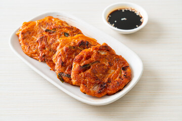 Wall Mural - Korean Kimchi pancake or Kimchijeon - Fried Mixed Egg, Kimchi, and Flour