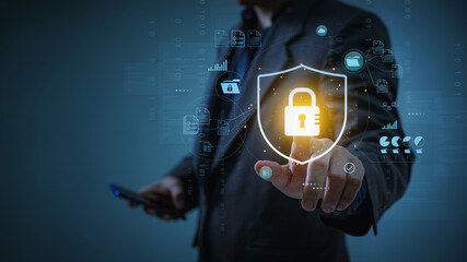 Wall Mural - Cyber security and data protection. Businessman holding padlock protecting  business and financial transaction data from cyber attack, user private data security encryption.