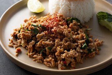 A closeup view of a plate of basil larb.