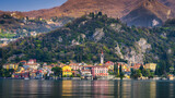 Fototapeta Paryż - Varenna old town on Lake Como, Italy with mountains in the background