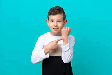 Wall Mural - Little kid boy isolated on blue background making the gesture of being late