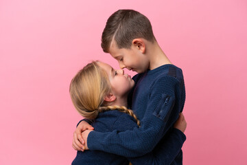 Wall Mural - Cute brothers over isolated pink background