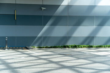 Wall Mural - empty concrete floor in front of modern buildings in the downtown street.