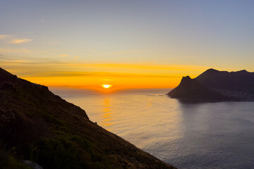 Wall Mural - Hout Bay coastal mountain landscape at sunset in Cape Town.