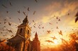 A church steeple illuminated by a golden sunset and surrounded by birds in flight