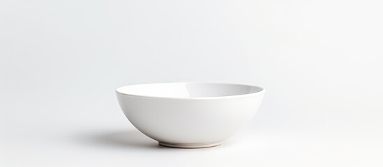 Fototapete - A simple white ceramic bowl with a stylish brown rim placed on a clean white surface
