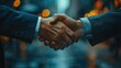 © Vitalii But - Close-up of a firm handshake between two businessmen in an urban environment, symbolizing partnership and agreement.