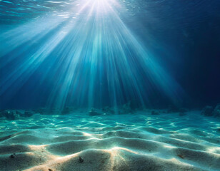 Wall Mural - underwater background deep blue sea and beautiful light rays with sandy floor