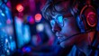© Sodapeaw - A man wearing glasses and a headset is playing a video game. The image has a moody and intense feel to it, as the man is fully immersed in the game. The blue and red lighting adds to the atmosphere