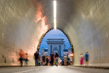 Fototapeta Uliczki - Tunnel, blurred people walking