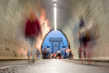 Fototapeta Uliczki - Tunnel, blurred people walking