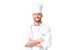 © luismolinero - Young caucasian chef over isolated chroma key background keeping the arms crossed in frontal position