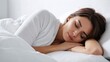 © Alexander - Girl sleeping in a snow-white bed hugging a pillow. Morning bedroom photo