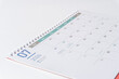 © Sam - Desk calendar of 2024 laying on white background. July page of 2024 calendar, side view and selective focus shot.