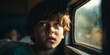 A lonely sad boy looks through the window of a moving train. Homeless orphan. Generative AI.