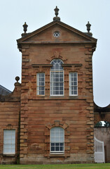 Wall Mural - Old 18th Century Stone Classical Pavilion with Pediment and Urns on Country Estate 