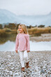 Kid 4 years old girl walking outdoor family travel lifestyle summer vacations child enjoying lake and mountains nature