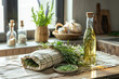 Rustic kitchen scene featuring fresh herbs, a bottle of infused oil, woven baskets, and garlic on a countertop, exuding a homey and natural vibe