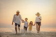 © Garun Studios - family, sunset, beach, children, run, together, walking, parent, childhood, sea. A family is playing in the sea, with the children holding hands. as the family enjoys their time together.
