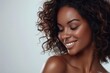 Close-up of a happy African American woman, natural beauty with a confident smile.