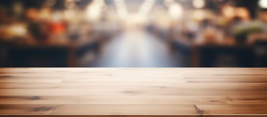 Wall Mural - A wooden table featuring hardwood flooring in the foreground, with a blurry sky background. The table is made of wood planks stained with a rich wood tone