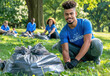 A young diverse group of friends in blue t-shirts and black gloves are collecting trash bags on green grass near a park with trees