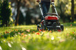 Professional gardener with manual lawn mower working in park. Trimming lawn, weeds and green grass and flowers. Selective focus.  AI Generative.