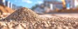 Close up of gravel pile on a construction site for road building Background includes sand and selective focus