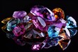 Jewel on black shine color, Collection of many different natural gemstones amethyst, lapis lazuli, rose quartz, citrine, ruby, amazonite, moonstone, labradorite, chalcedony, blue topaz	
