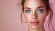  young woman with freckles and blue eyes on pink background