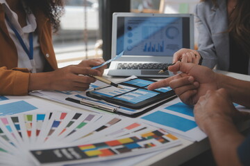 Close up ux developer and ui designer use augmented reality brainstorming about mobile app interface wireframe design on desk at modern office.Creative digital development agency