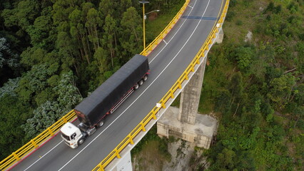 Canvas Print - aerial images of the highway that crosses the central mountain range with its bridges and traffic