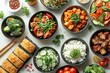© Graph Squad - A variety of colorful bowls filled with different types of food, including vegetables and fruits. The bowls are arranged in a way that creates a visually appealing