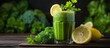 A glass of green smoothie garnished with lemon slices served on a wooden table. Ingredients include plantbased ingredients like grass and herbs for a refreshing drink