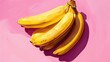 © Cherkasova Alie - A bunch of bananas on a pink background. An exotic fruit. Delicious and juicy bright yellow bananas.