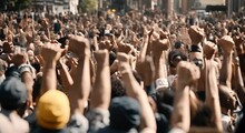 People Raising Their Fists In A Demonstration.