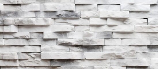 Poster - A closeup shot of a rectangular grey brick wall showcasing the intricate brickwork pattern and material properties of the building material