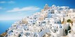 Escape to the Mediterranean coast with this captivating image of whitewashed buildings cascading down the hillside. Let the timeless allure of this architectural style.