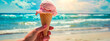 ice cream in hand against the backdrop of the sea. selective focus.