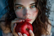 Woman holding apple in her hands, tempting, mysterious smile.