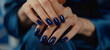 A deep navy blue single-tone manicure