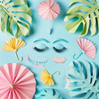 summer beach background with palm leaf,  monstera leaf,sunglasses, Eyelashes and umbrellas. Creative summer concept.