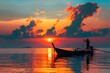 Scene of sunrise and beautiful sky background. Silhouette of a fisherman on longtail boat in the sea