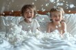Home playtime scene with children engaged in a pillow fight on a messy bed