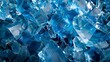 Bright blue crystalline structures scattered with light reflections. Shattered blue crystal textures in detailed composition. Dynamic arrangement of blue crystal shards reflecting light.